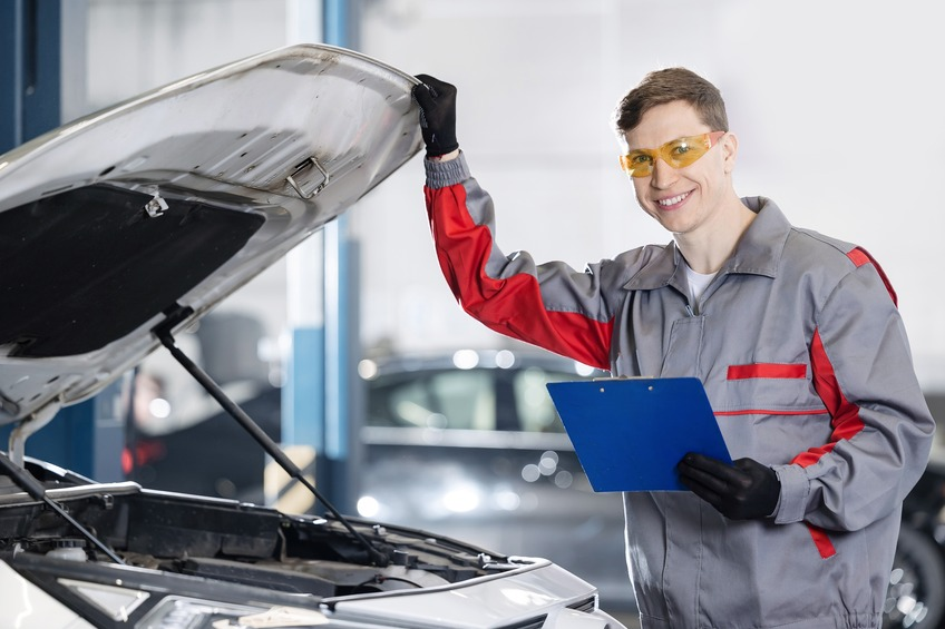 mechanic performing an MOT test on a car at an ExpressMot centre